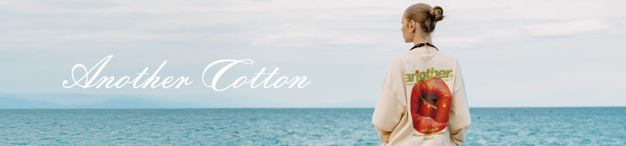 Model in sunny holiday setting wearing T-shirt from Another Cotton Lab