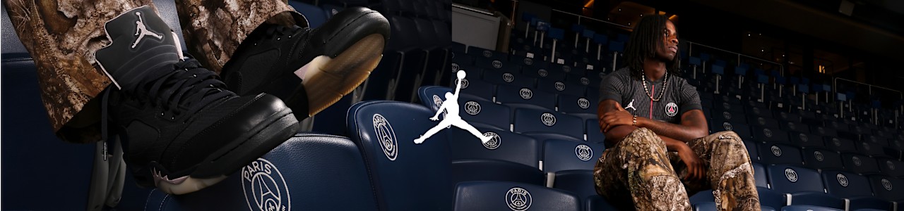 Jordan PSG Black sneakers and male model wearing PSG 4th Jersey and Jordan camo pants