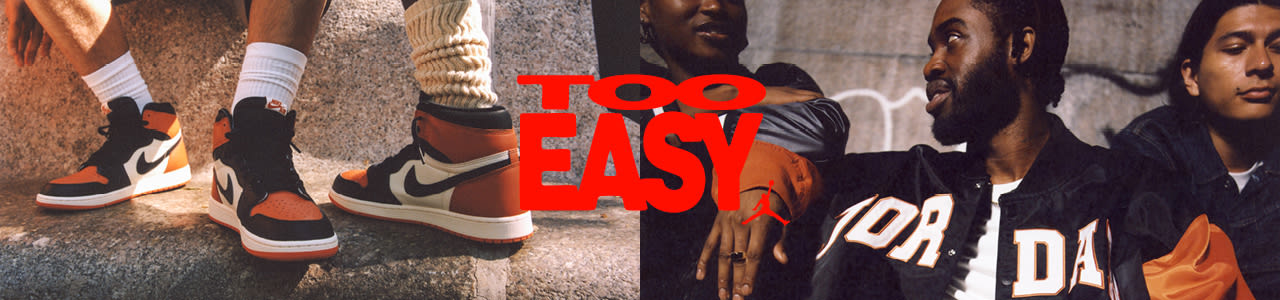 Men in urban environment wearing jordan apparel and jordan 1 sneakers