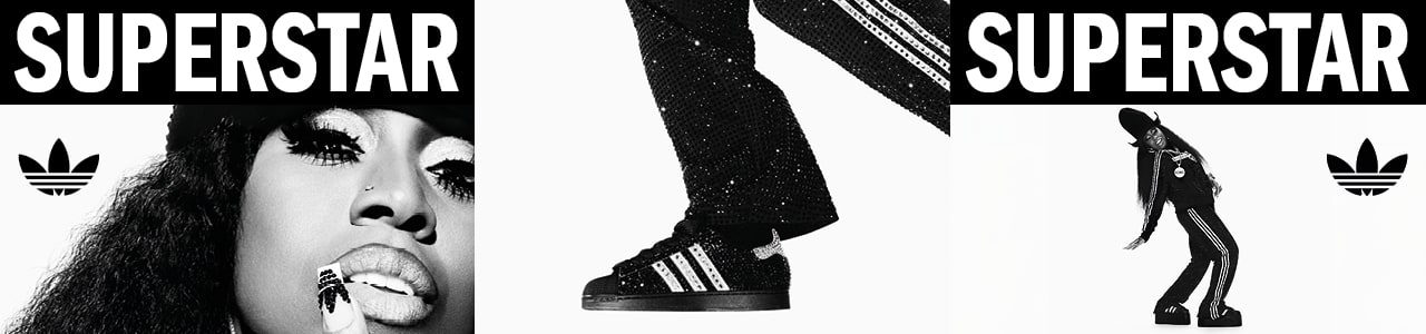 black and white image of rapper Missy Elliot wearing black adidas Superstar II sneakers and black adidas tracksuit
