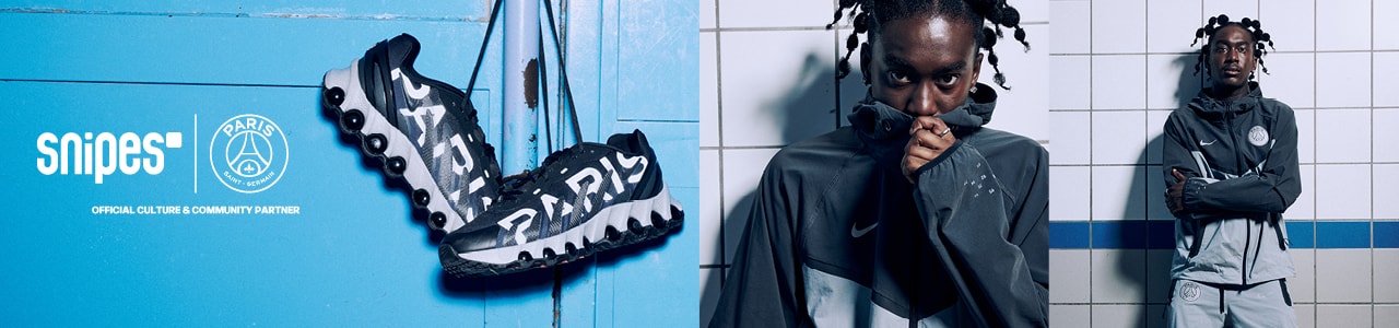 Model wearing blue and grey Nike x PSG tracksuit with dark blue Air Max Dn8 shoes from the PSG Paname collection
