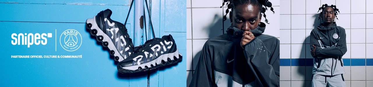 Model wearing blue and grey Nike x PSG tracksuit with dark blue Air Max Dn8 shoes from the PSG Paname collection