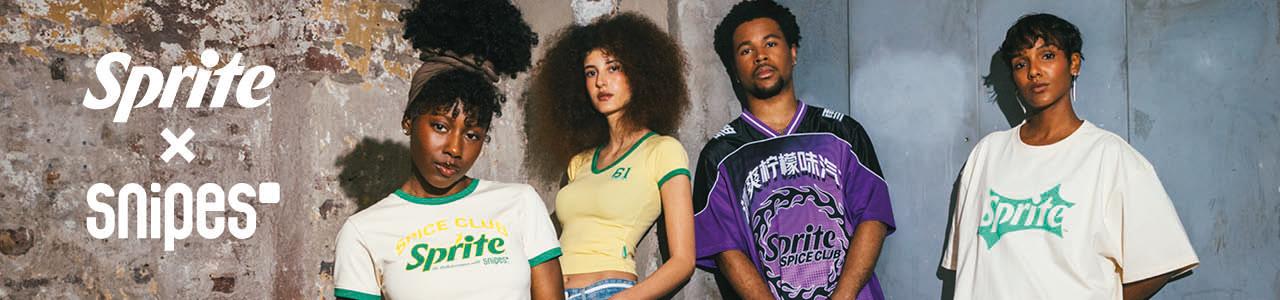 Group of models leaning against brick wall wearing sprite x snipes collection apparel