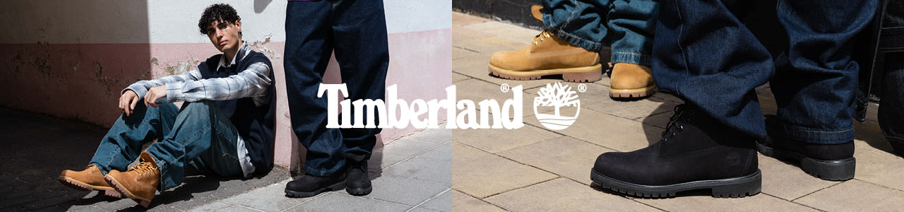 Models wearing timberland 6 inch boots and streetwear while posing underneath a bridge