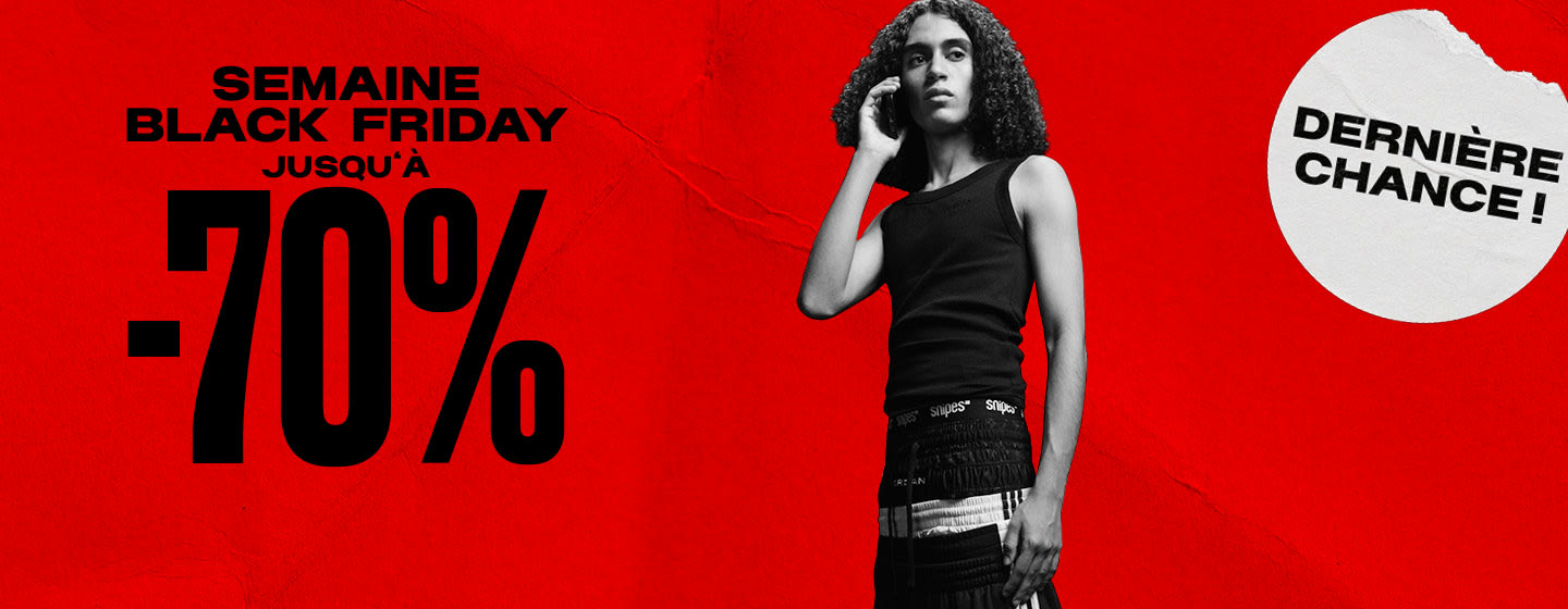 black & white image of model wearing streetwear clothing standing in front of red back ground with text: Black week up to -70%, last call