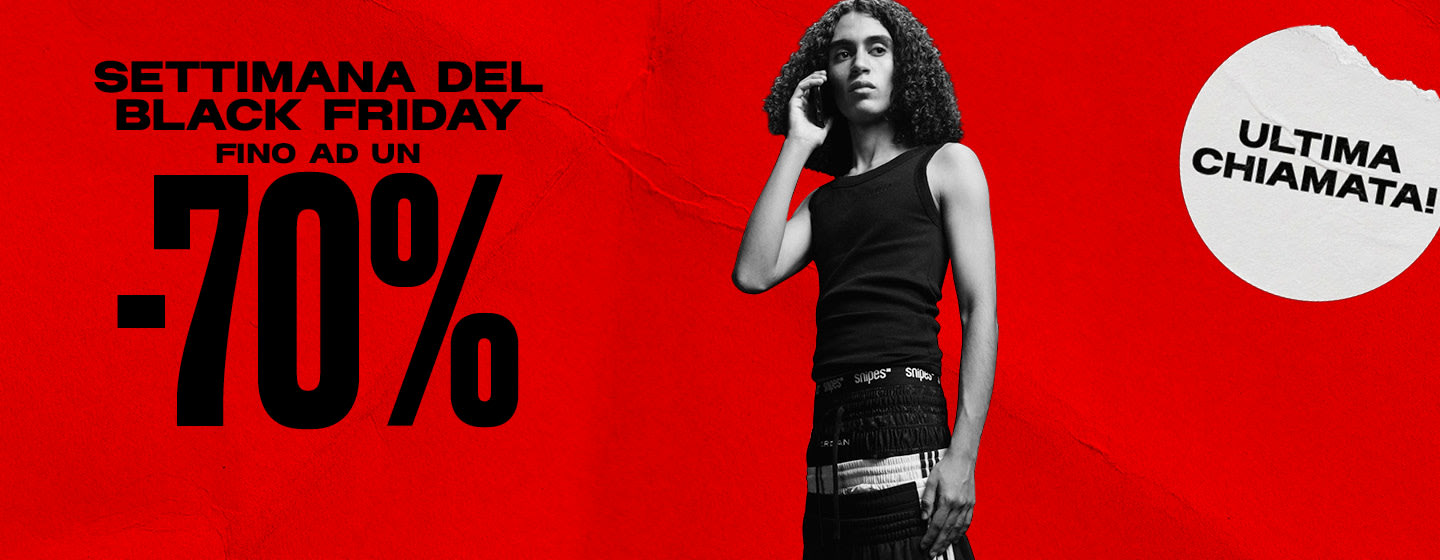 black & white image of model wearing streetwear clothing standing in front of red back ground with text: Black week up to -70%, last call