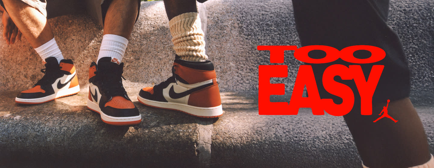 Men in urban environment wearing jordan apparel and jordan 1 sneakers