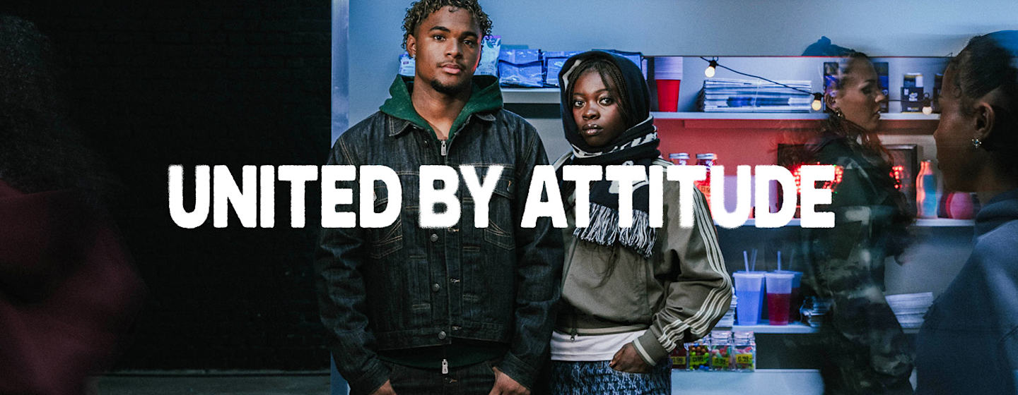 models in the background and United by Attitude claim in a white font in the middle of the image