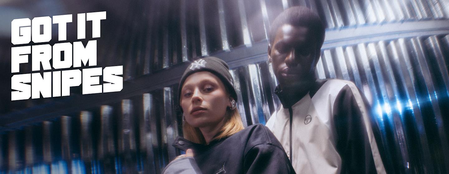 Models wearing autumn streetwear clothing, while standing in a silver futuristic setting. Text on the image says "Got it from snipes"
