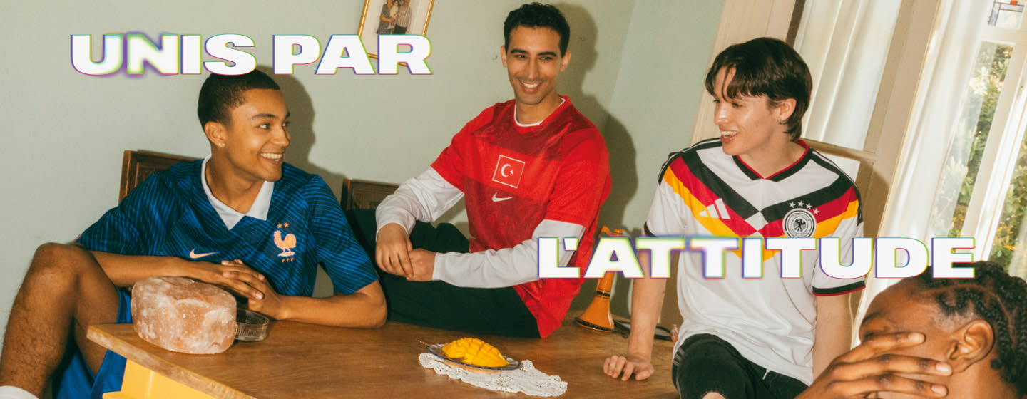 A diverse group of people posing outdoors at night wearing various international soccer jerseys, including teams like the Netherlands, Germany, Brazil, Morocco, Argentina, and Senegal. Large, bold white text on the right reads "UNIS PAR L'ATTITUDE."