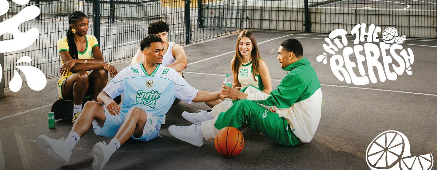 group of models sitting on sunny basketball court wearing sprite streatwear and sharing a sprite drink. Text: Hit the refresh