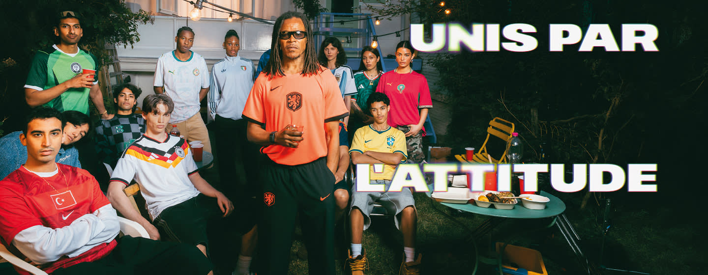 A diverse group of people posing outdoors at night wearing various international soccer jerseys, including teams like the Netherlands, Germany, Brazil, Morocco, Argentina, and Senegal. Large, bold white text on the right reads "UNIS PAR L'ATTITUDE."