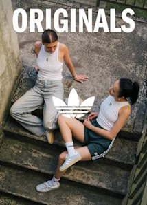 group of women in the street wearing adidas t-toe sneakers and summer apparel