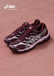 Image of pair of pink and metallic grey asics sneakers on pink concrete underground