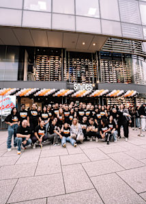 crowd of people standing in front of a new SNIPES Store