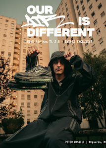 A young man in a black hooded tracksuit sits outdoors in front of tall apartment buildings, holding up a pair of black Nike Air Max TL 2.5 sneakers with green soles. The ad features bold white text reading “OUR AIR IS DIFFERENT” along with “NIKE Air Max TL 2.5 – SNIPES EXCLUSIVE.” At the bottom right