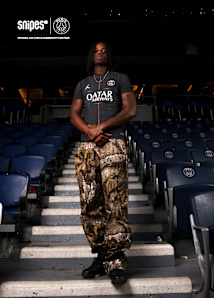 models standing the PSG football stadion while wearing the Jordan PSG 4th Jersey
