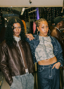 group of people hanging out together in a hair shop