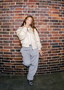 Creator Zahide and friends wearing autumn themed streetwear while posing in the streets