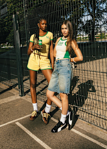 Two women standing in a parking wearing the collab sprite x snipes