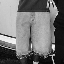 images in black and grey of models wearing sneakers and streetwear apparel