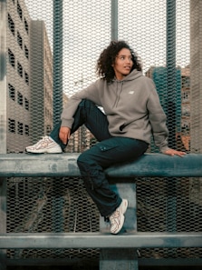 Girl wearing a New Balance hoodies and trackpants