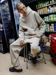 Men wearing new balance a beige tracksuit 