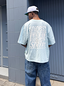 Male model wearing streetwear while posing in the streets
