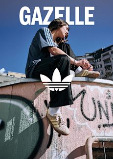 woman sitting on roof wearing adidas apparel and Gazelle shoes