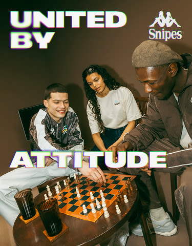 group of people wearing the new Kappa x Snipes collection and playing chess