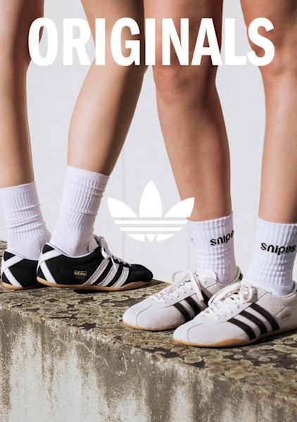 Models in urban environment wearing adidas Lo-Profile sneakers and adidas summer wear