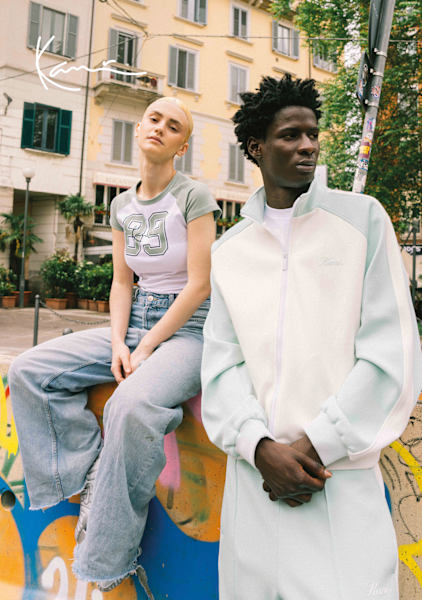 Young models in urban environment wearing Karl Kani streetwear