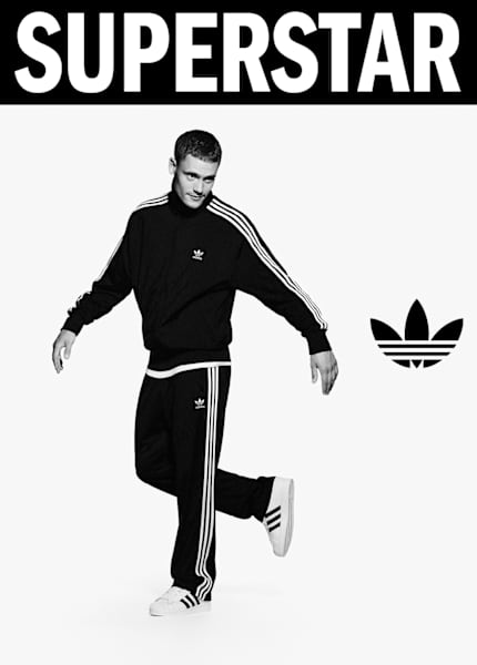 black and white image of athlete Flo Wirtz wearing white adidas Superstar II sneakers and black adidas tracksuit