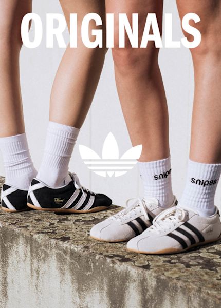Models in urban environment wearing adidas Lo-Profile sneakers and adidas summer wear