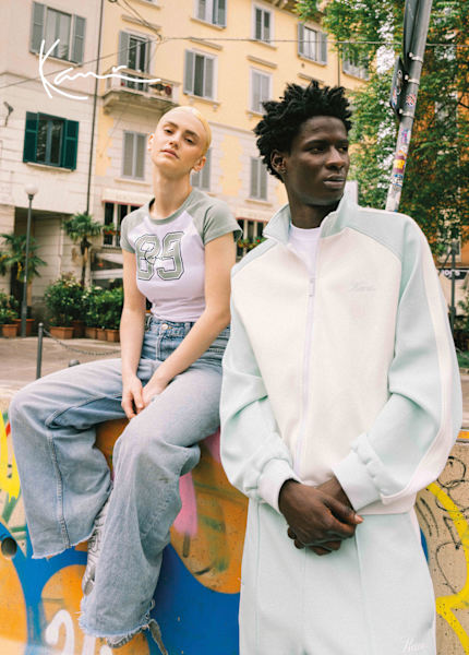 Young models in urban environment wearing Karl Kani streetwear