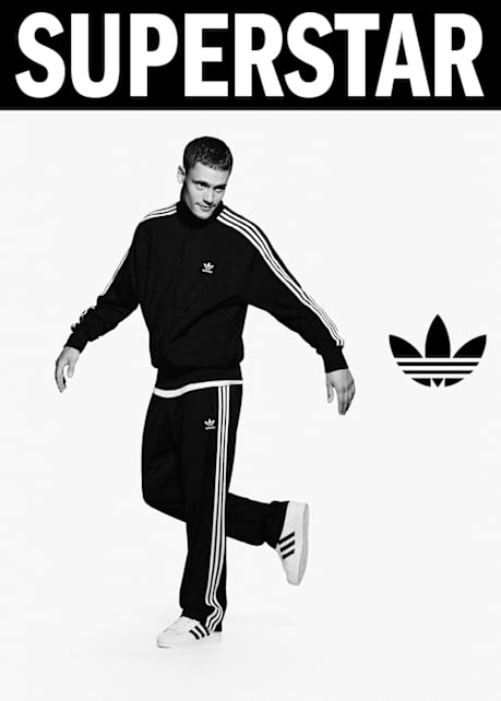 black and white image of athlete Flo Wirtz wearing white adidas Superstar II sneakers and black adidas tracksuit