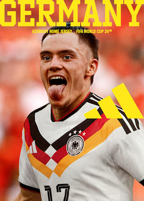 An image features a man wearing a Germany Home Jersey for the FIFA World Cup 26™. The jersey is white with a stylized, wide shoulder/neck trim in black, red, and gold/yellow (the German flag colors), and features the German national team crest. The man is celebrating enthusiastically with his tongue sticking out. Above him, the text reads: GERMANY, GERMANY HOME JERSEY, and FIFA WORLD CUP 26™. A partial Adidas logo is visible on the right.