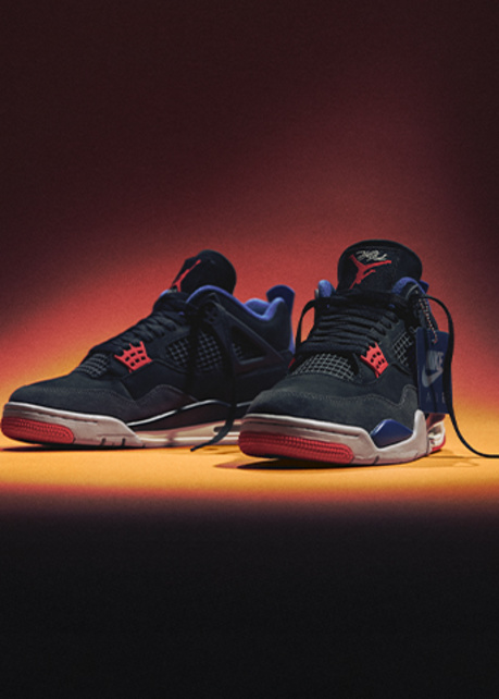 Air Jordan 4 Retro "RARE AIR" black and red, on a orange and black background