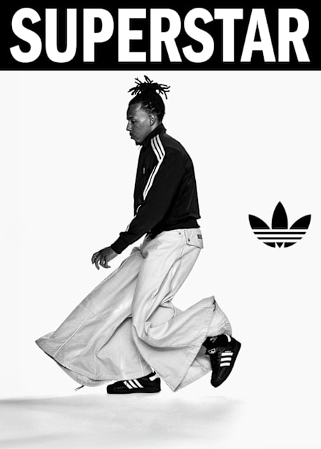 black and white image of athleJules Koundé wearing adidas Superstar II sneakers and black and white adidas apparel