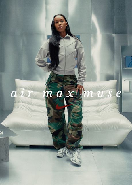 models in a futuristic locker room wearing Nike apparel and silver air max muse sneakers.