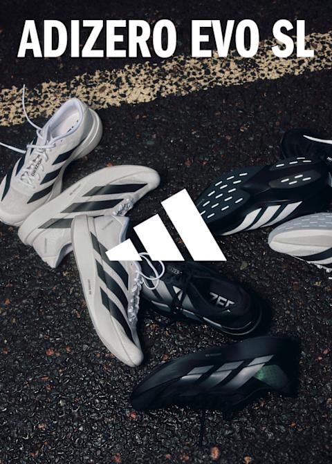 adidas  adizero sneaker on the asphalt white and black shoe with stripes