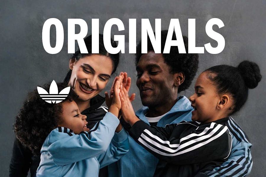 A series of promotional images for Adidas Originals featuring a diverse group of people, including families and friends, posing in a studio setting. They are wearing various Adidas apparel such as tracksuits, t-shirts, and sneakers, showcasing the classic three-stripe design and trefoil logo. The images carry the bold text "ORIGINALS" and "THE ORIGINAL" against a neutral, textured grey background, highlighting themes of connection, heritage, and individual style.