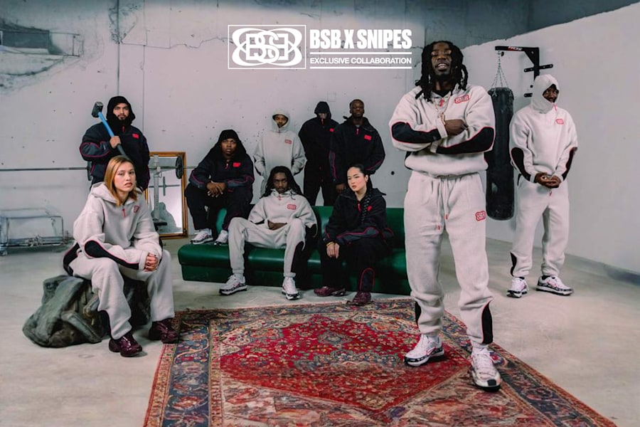 group of people wearing the new BSB x Snipes collection of grey and black sweatjackets and sweatpants.  White logo on the image BSB x Snipes Exclusive Collection