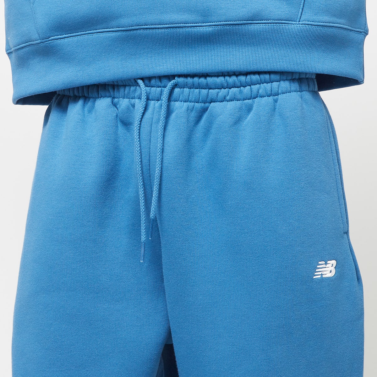 New Balance Sport Essentials Fleece Jogger Trainingsbroeken in blauw formaten: XL