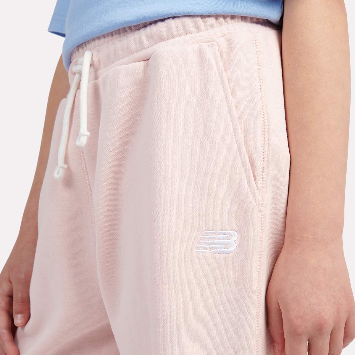 New Balance French Terry Small Logo Jogger unisex Trainingsbroeken lichtroze Kleding
