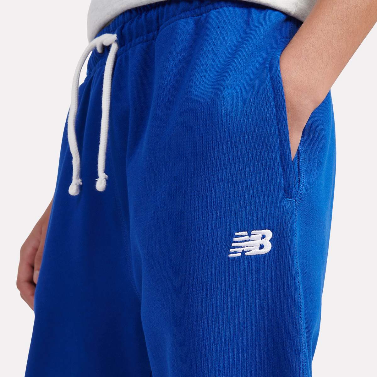 New Balance French Terry Small Logo Jogger unisex Trainingsbroeken blauw Kleding