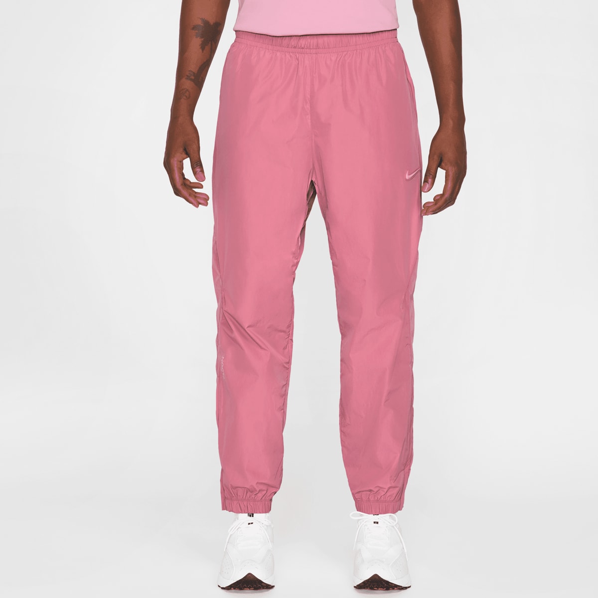 Nike Nocta NRG CS Woven Track Pants men Trainingsbroeken lichtroze Maat M Kleding