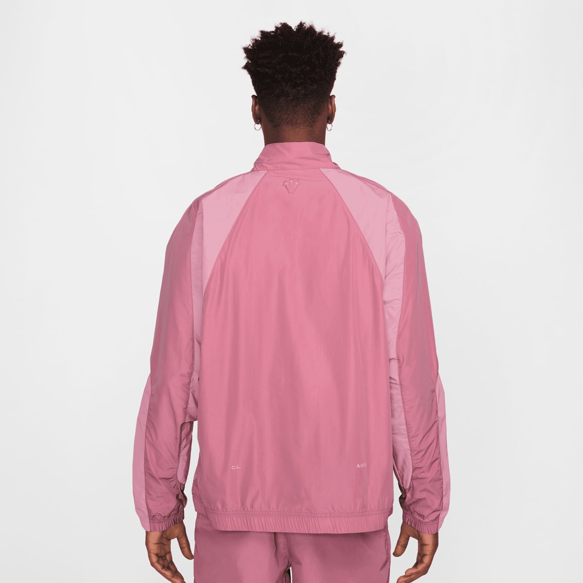 Nike Nocta NRG CS Woven Track Jacket Trainingspakken in lichtroze formaten: L