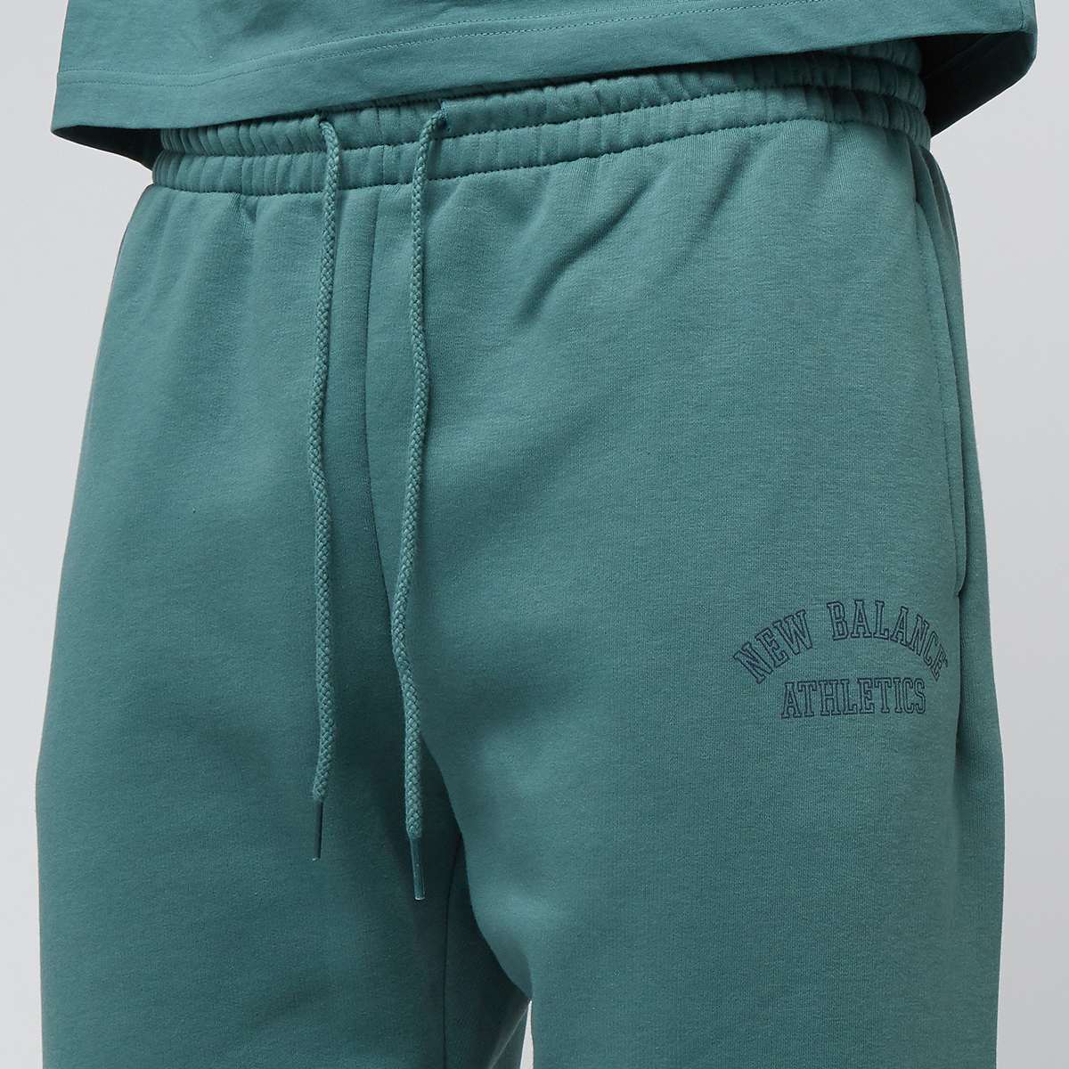 New Balance Sport Essentials Fleece Graphic Jogger Trainingsbroeken in groen formaten: S
