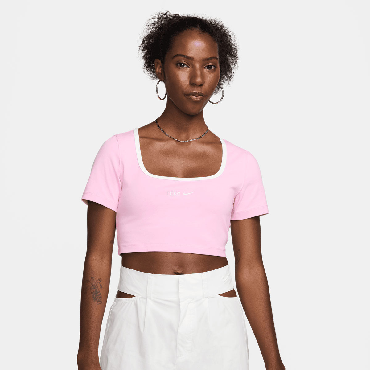 Baby pink nike top on sale